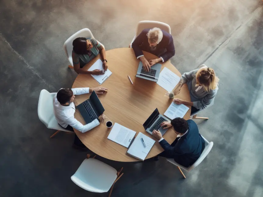 Senior leadership team reviewing reports and performance data during strategic resilience diagnostic meeting.